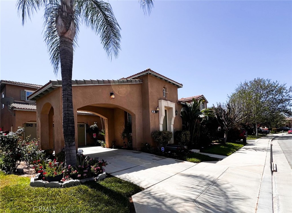 3857 Bella Torre Road Perris, CA 92571 - Photo 2 of 25 a front view of a house with yard and tree