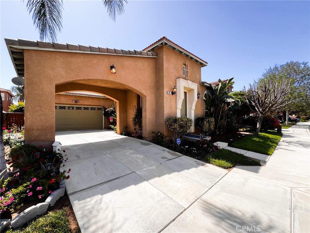 3857 Bella Torre Road Perris, CA 92571 - Photo 3 of 25 a front view of a house with a yard