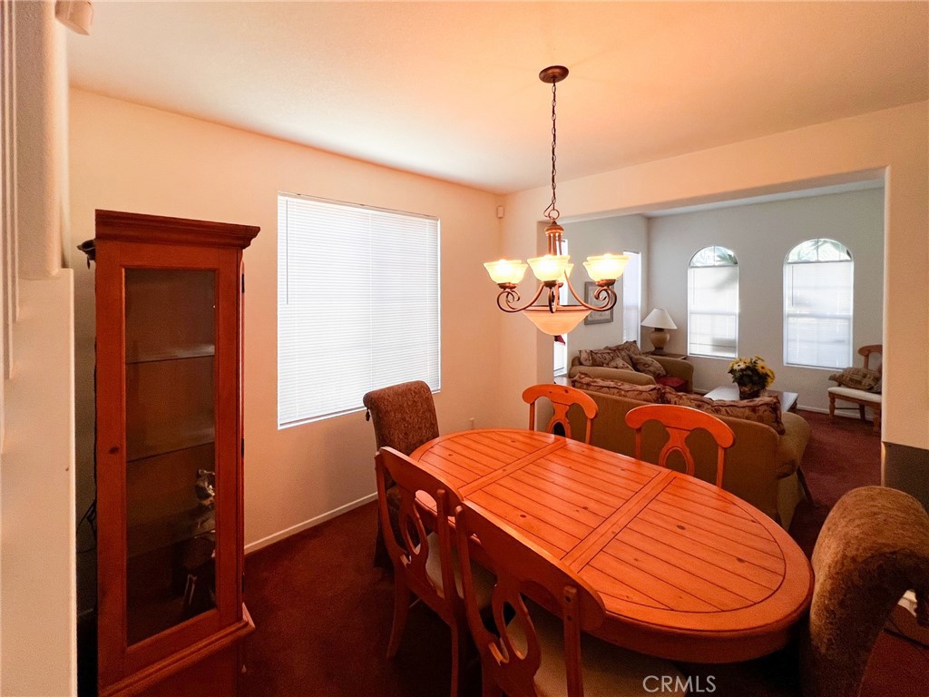 3857 Bella Torre Road Perris, CA 92571 - Photo 6 of 25 a view of a dining room with furniture