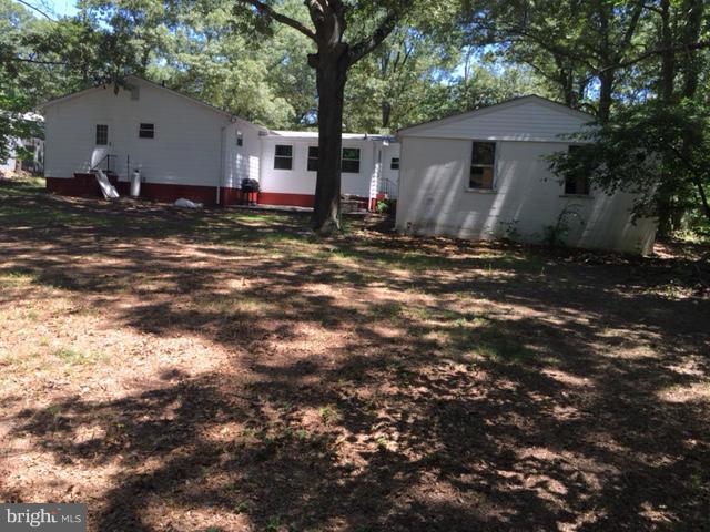 6805 Mackall Road St. Leonard, MD 20685 - Photo 2 of 30 a house view with a backyard space