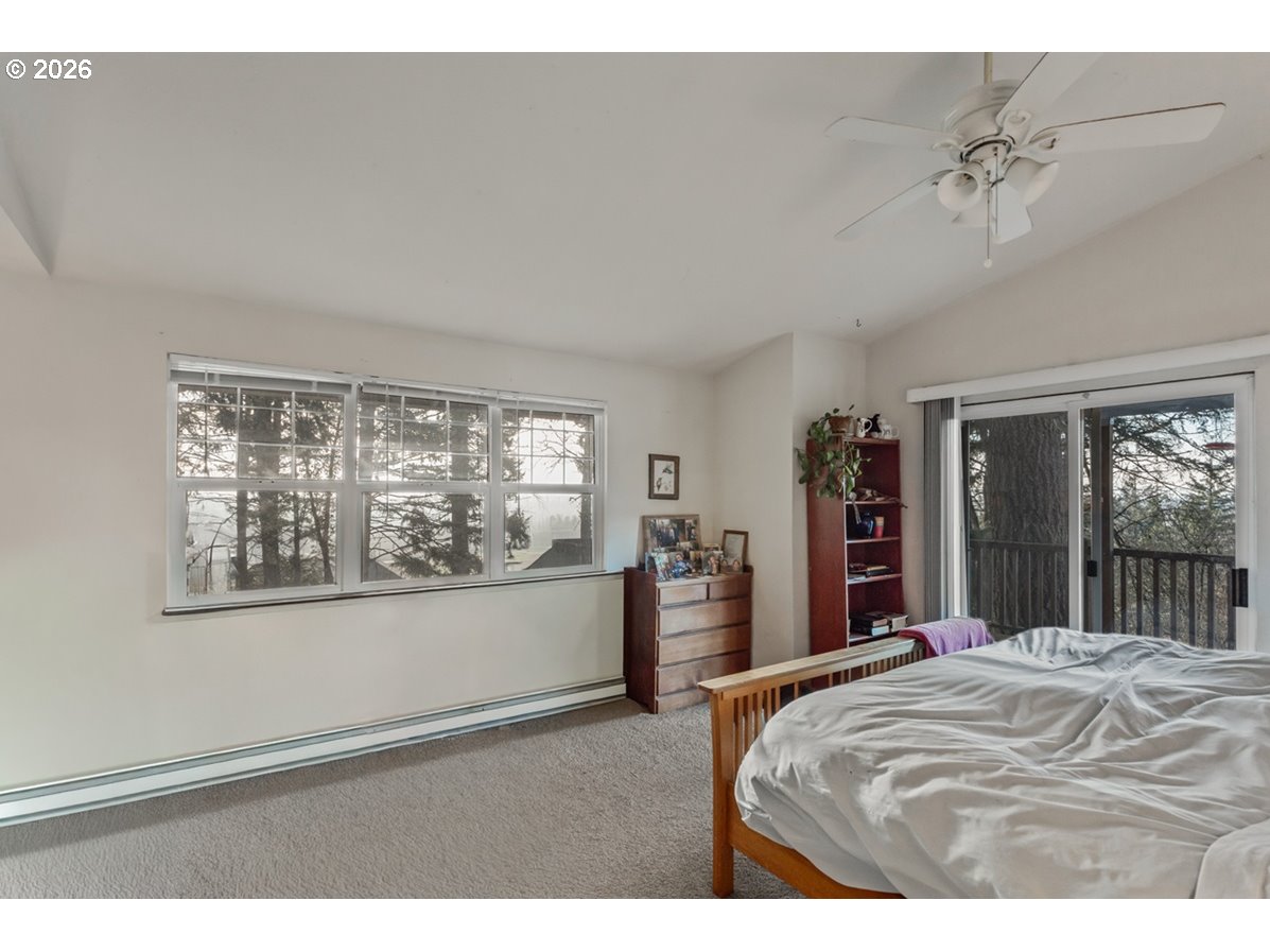 4210 Northeast Breyman Orchards Road Dayton, OR 97114 - Photo 19 of 48 a bedroom with a large bed and a large window