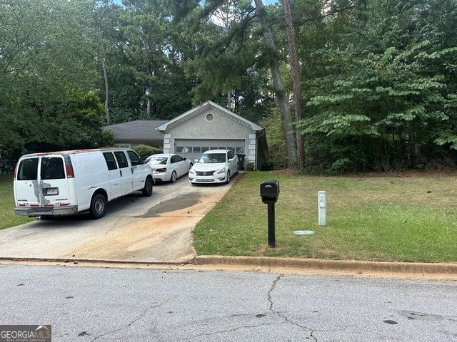 2021 Huntcliff Drive Suwanee, GA 30024 - Photo 2 of 3 a front view of a house with a yard