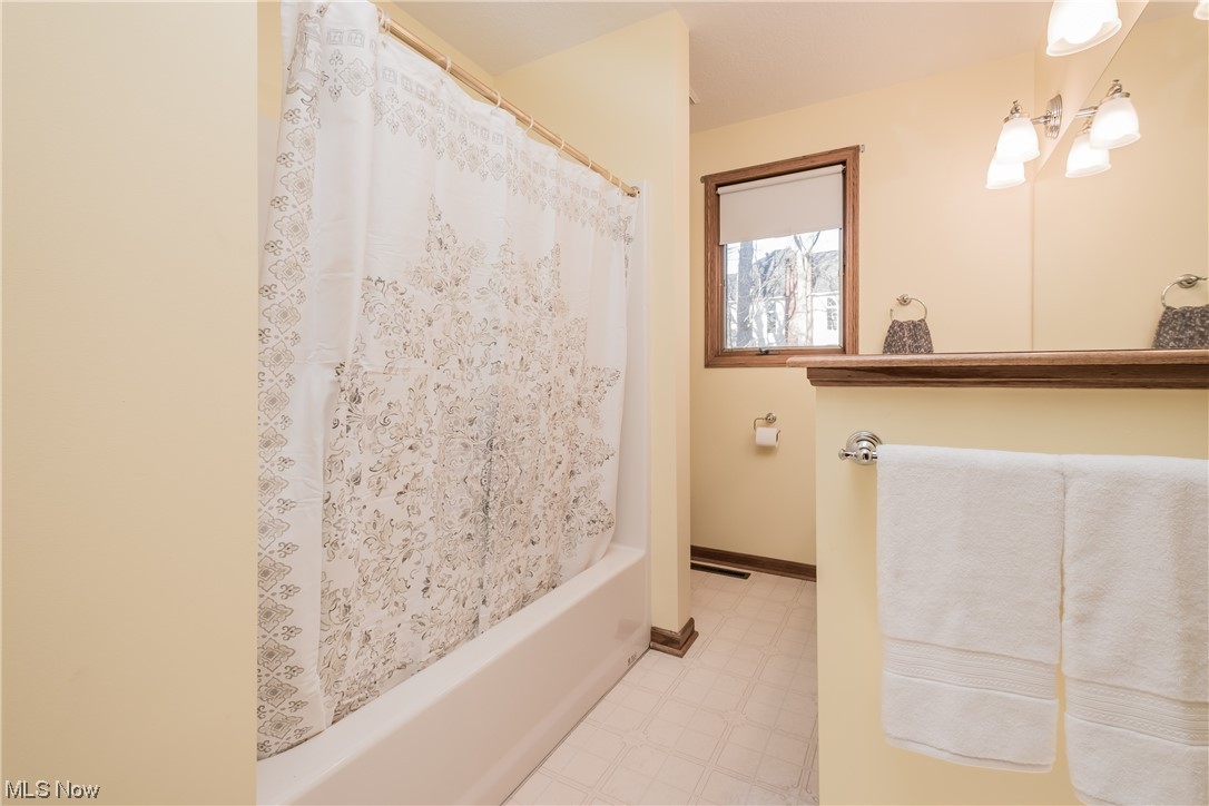 6216 Rockside Circle Northwest Canton, OH 44718 - Photo 26 of 33 Bathroom with tile flooring and shower / bath combo