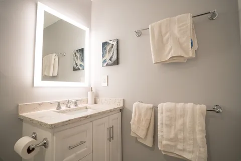 a bathroom with a sink and mirror