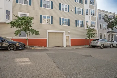 a view of a car parked in front of a building