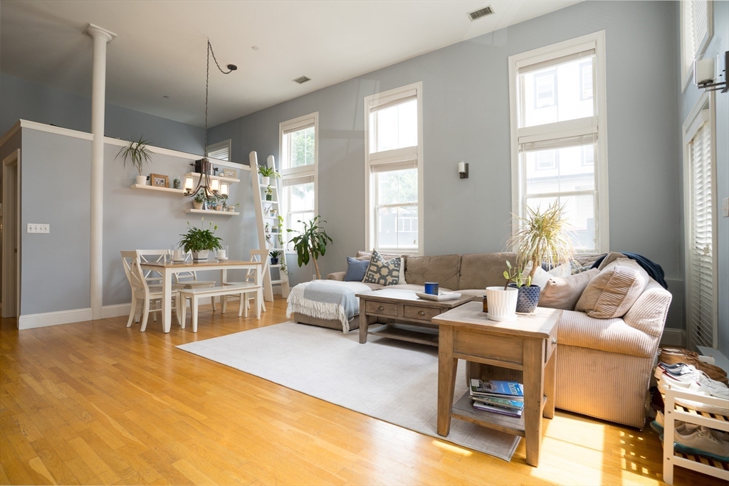 352 West 3rd Street, Unit 9 Boston, MA 02127 - Photo 2 of 18 a living room with furniture and a large window