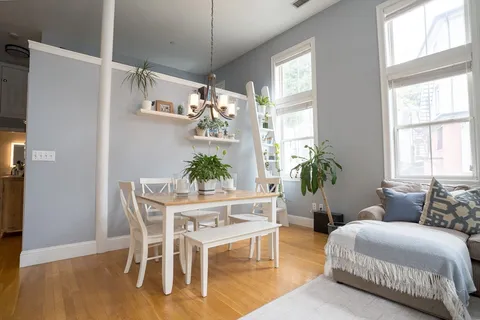 a bedroom with a bed and a table