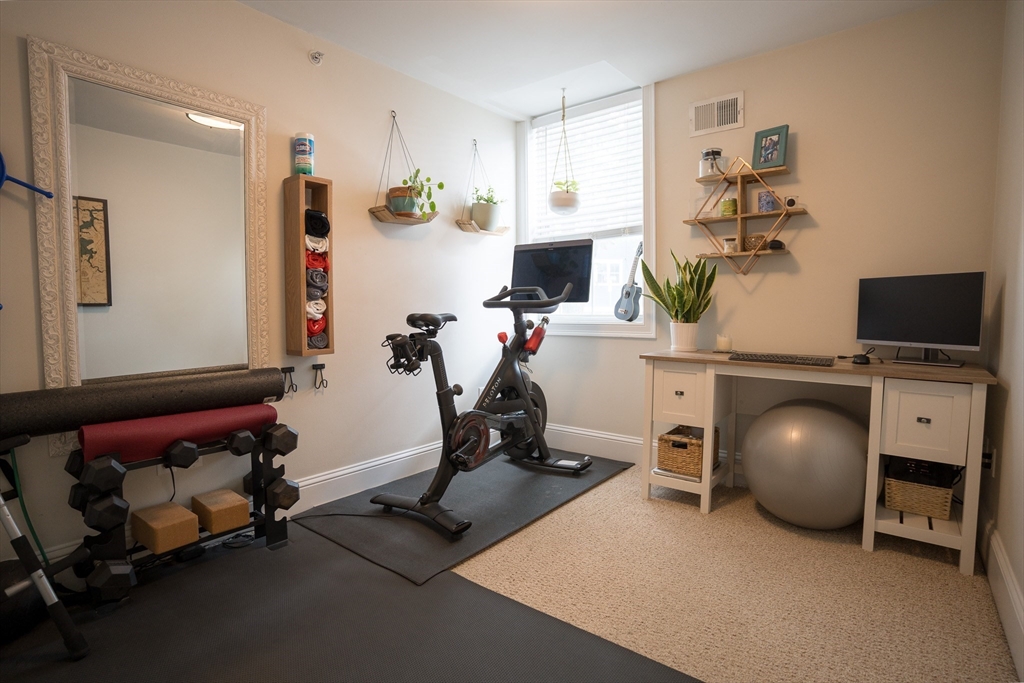 352 West 3rd Street, Unit 9 Boston, MA 02127 - Photo 8 of 18 a view of a workspace with gym equipment