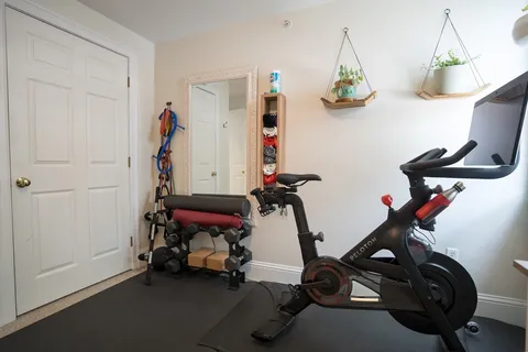 a view of gym equipment with windows