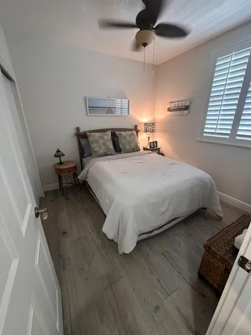 a bedroom with bed and window