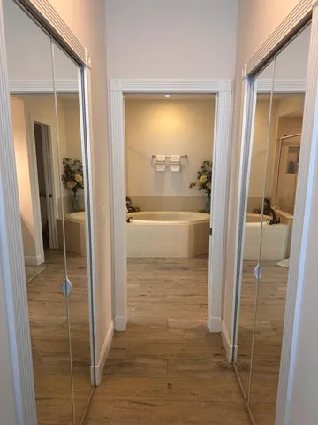 a bathroom with a glass shower door
