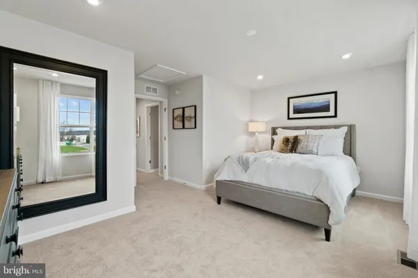 a bedroom with a bed and walk in closet