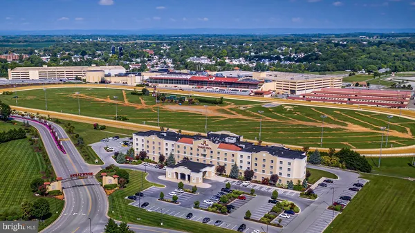a living room with furniture and a window with wooden floor