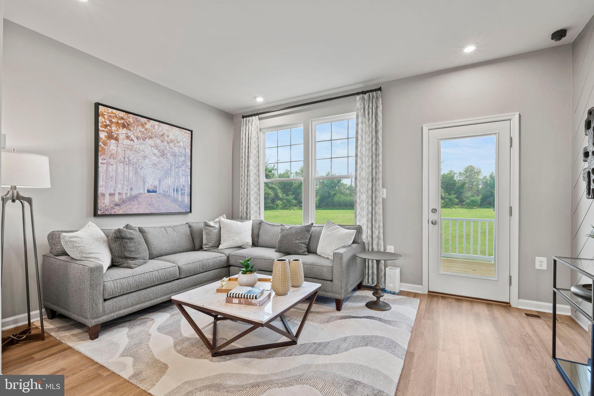 304 Presidents Pointe Avenue, Unit 610 Ranson, WV 25438 - Photo 51 of 87 Hastings- Great Room staged