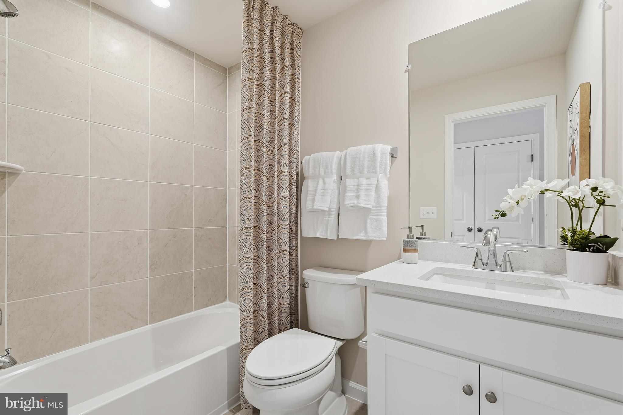 304 Presidents Pointe Avenue, Unit 610 Ranson, WV 25438 - Photo 56 of 87 a bathroom with a sink toilet and shower