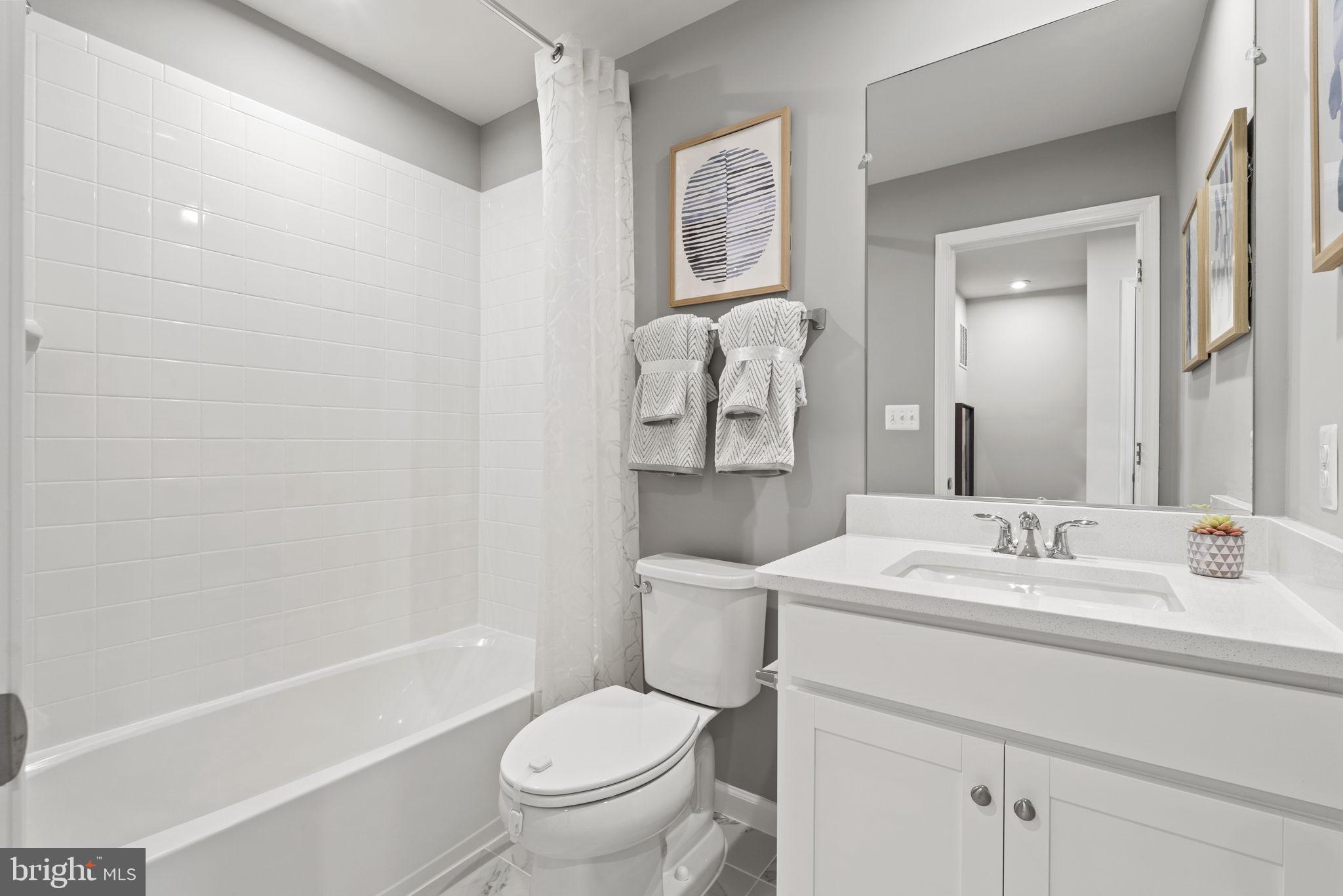 304 Presidents Pointe Avenue, Unit 610 Ranson, WV 25438 - Photo 75 of 87 a bathroom with a sink toilet and shower