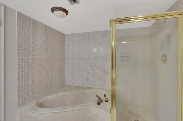 a view of a dining room with furniture large windows and wooden floor