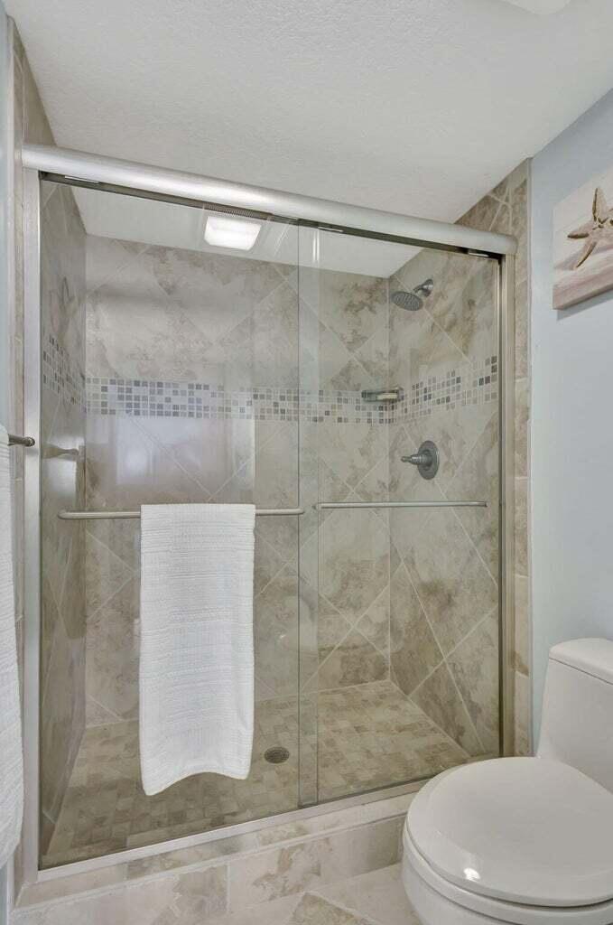 4200 North Ocean Drive, Unit 2201 Singer Island, FL 33404 - Photo 42 of 65 a bathroom with a shower and a toilet