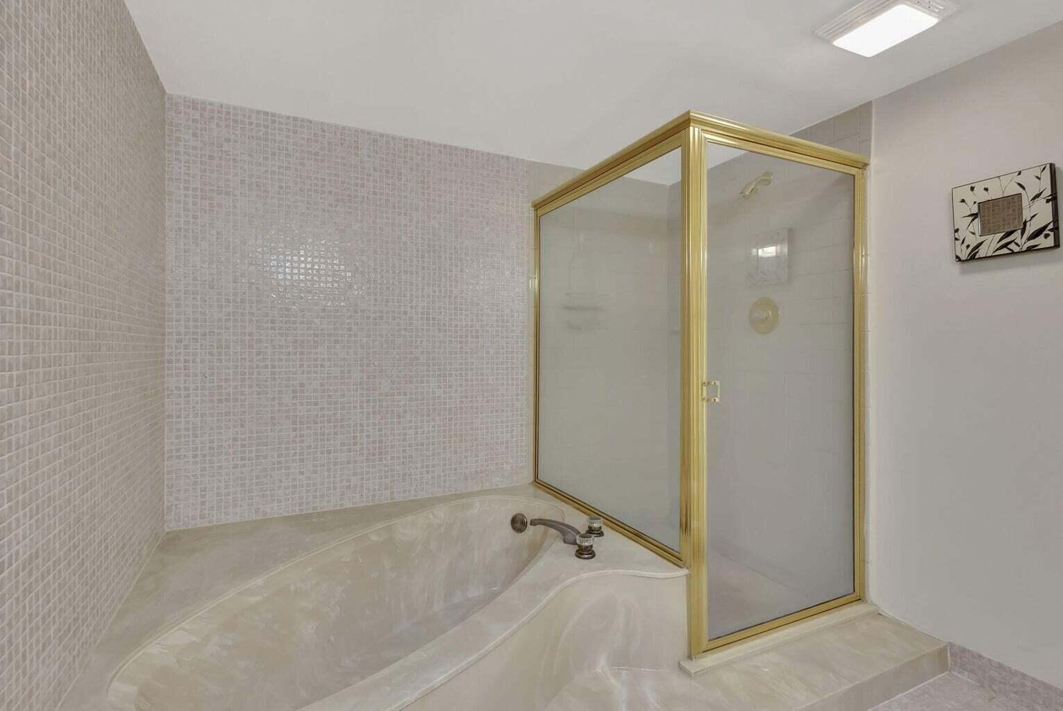 4200 North Ocean Drive, Unit 2201 Singer Island, FL 33404 - Photo 56 of 65 a bathroom with a shower and a glass door