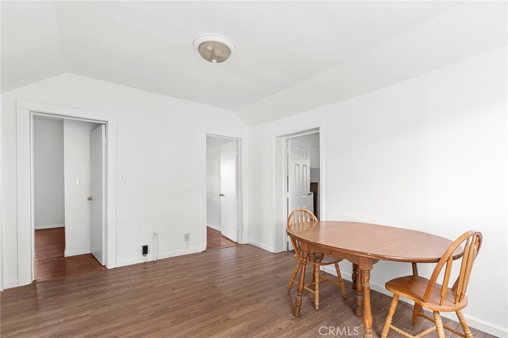 818 6th Street Corning, CA 96021 - Photo 13 of 32 a view of a room with wooden floor table and chairs
