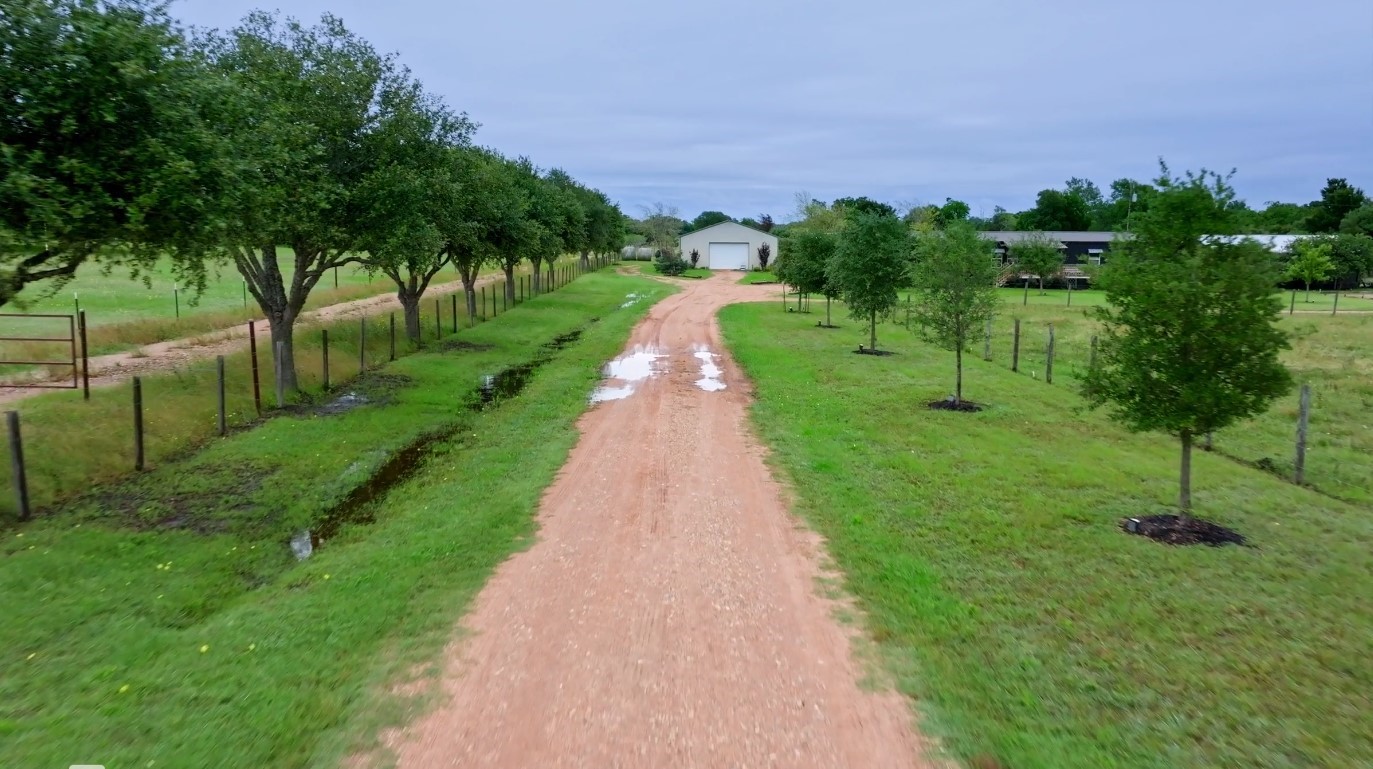 3643 Noak Road Round Top, TX 78954 - Photo 29 of 32 Driveway leading to the 2 cabins, barn and Airstream.