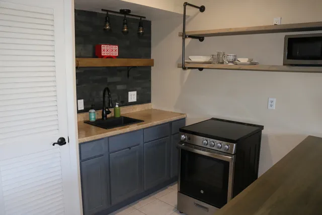 a kitchen with a stove and a microwave