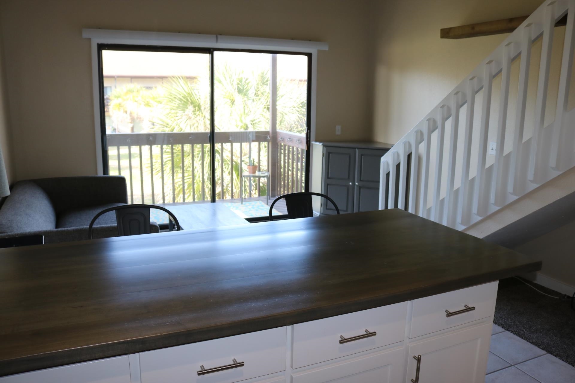 1255 Ponce Island Drive, Unit 768 St. Augustine, FL 32095 - Photo 3 of 14 a view of living room with furniture and floor to ceiling window