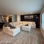 464 Box Canyon Road Alamo, NV 89001 - Photo 8 of 48 Plush carpet and recessed lighting enhance this modern, open-concept living space.