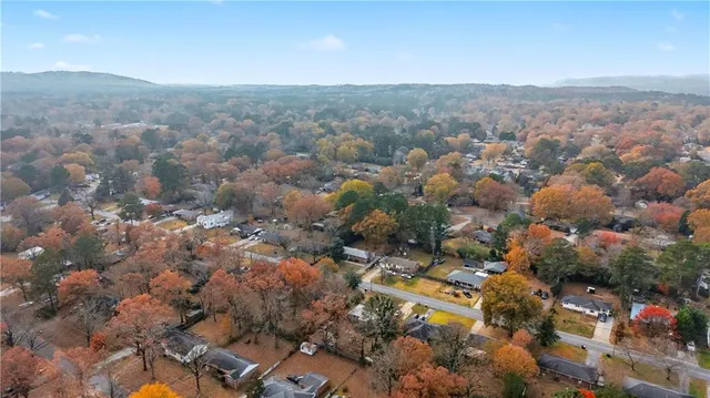 an aerial view of a houses with a yard