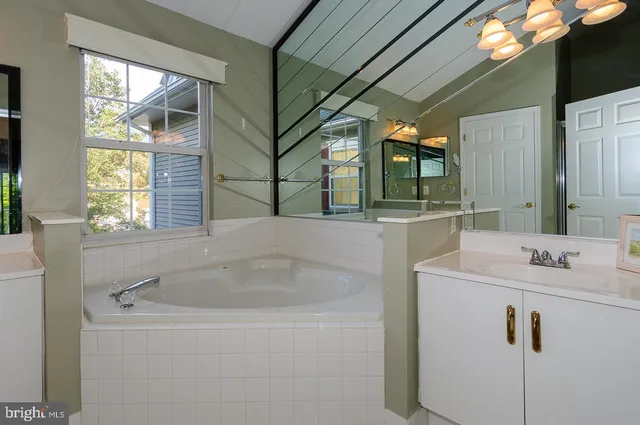 a bathroom with a sink and mirror