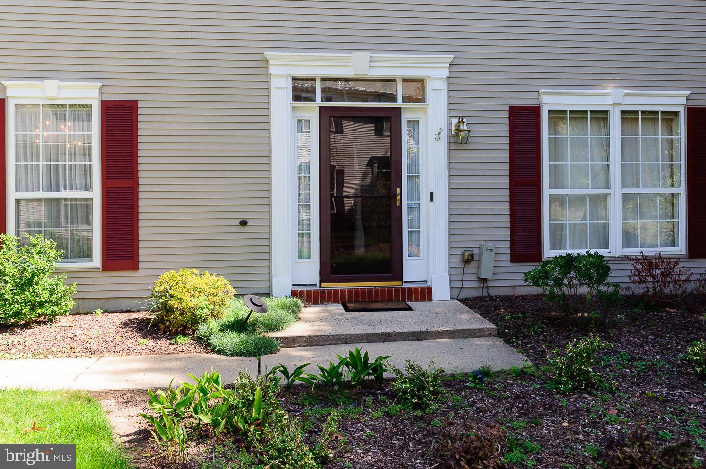 109 Deer Run Court Pennington, NJ 08534 - Photo 3 of 25 a front view of a house with garden