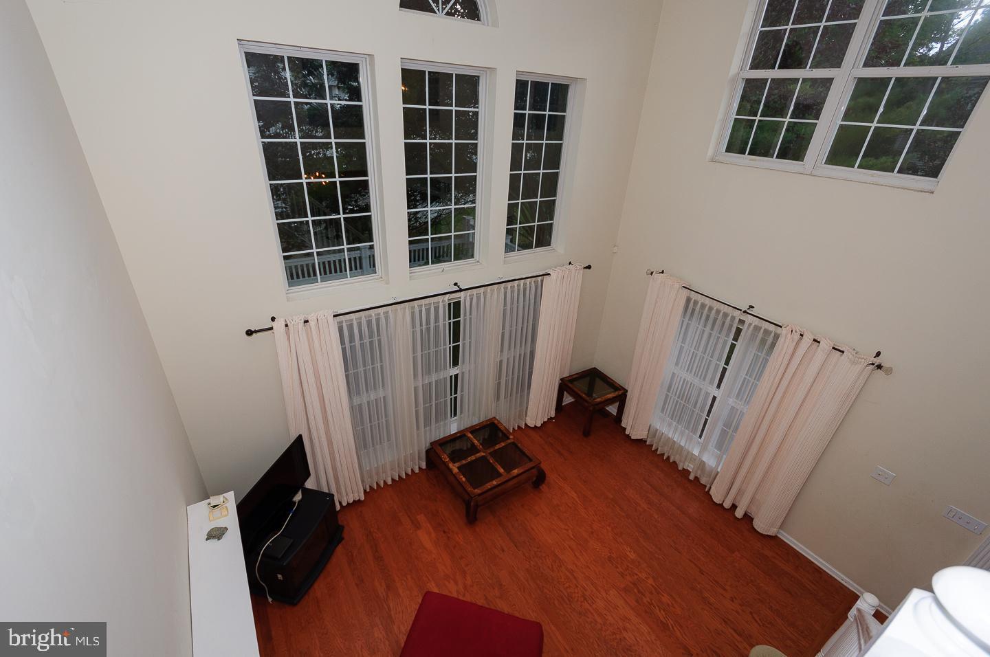 109 Deer Run Court Pennington, NJ 08534 - Photo 9 of 25 a view of a door with wooden floor and windows