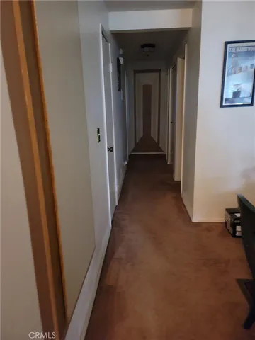 a view of a hallway with a closet