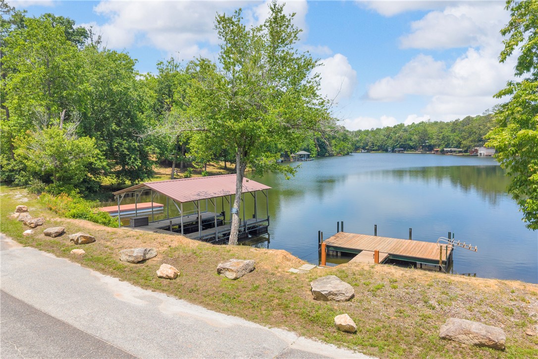 334 Lake Becky Road Mountain Rest, SC 29664 - Photo 26 of 46 Boasting direct lake access with a private dock and covered boat slip for endless aquatic adventures.