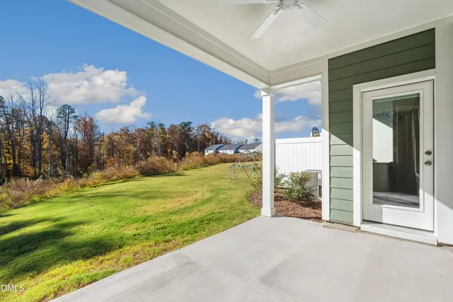 a view of a big room with floor to ceiling windows and yard