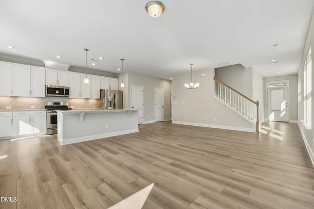 a view of kitchen with wooden floor and window