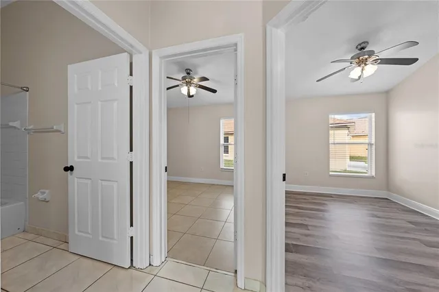 a view of an entryway with wooden floor