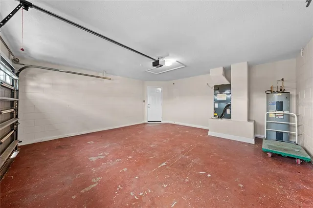 a view of a house with backyard and a garden