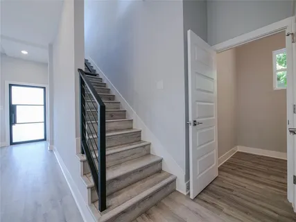 a bathroom with a sink toilet and window