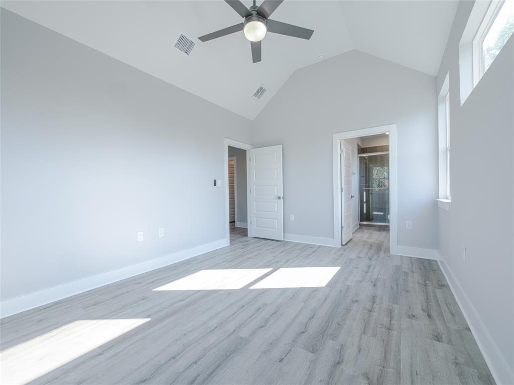 1042 Rosemont Street, Unit 1 Austin, TX 78723 - Photo 16 of 31 wooden floor in an empty room with a window