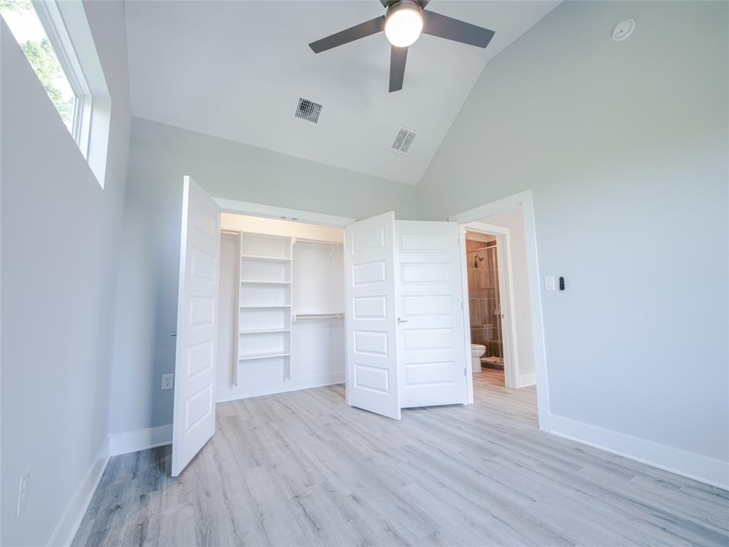 1042 Rosemont Street, Unit 1 Austin, TX 78723 - Photo 21 of 31 wooden floor in an empty room with a window
