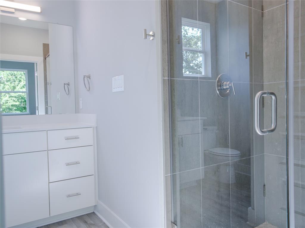 1042 Rosemont Street, Unit 1 Austin, TX 78723 - Photo 27 of 31 a bathroom with a shower