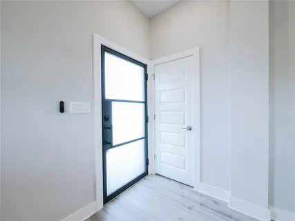 a view of empty room with closet and window