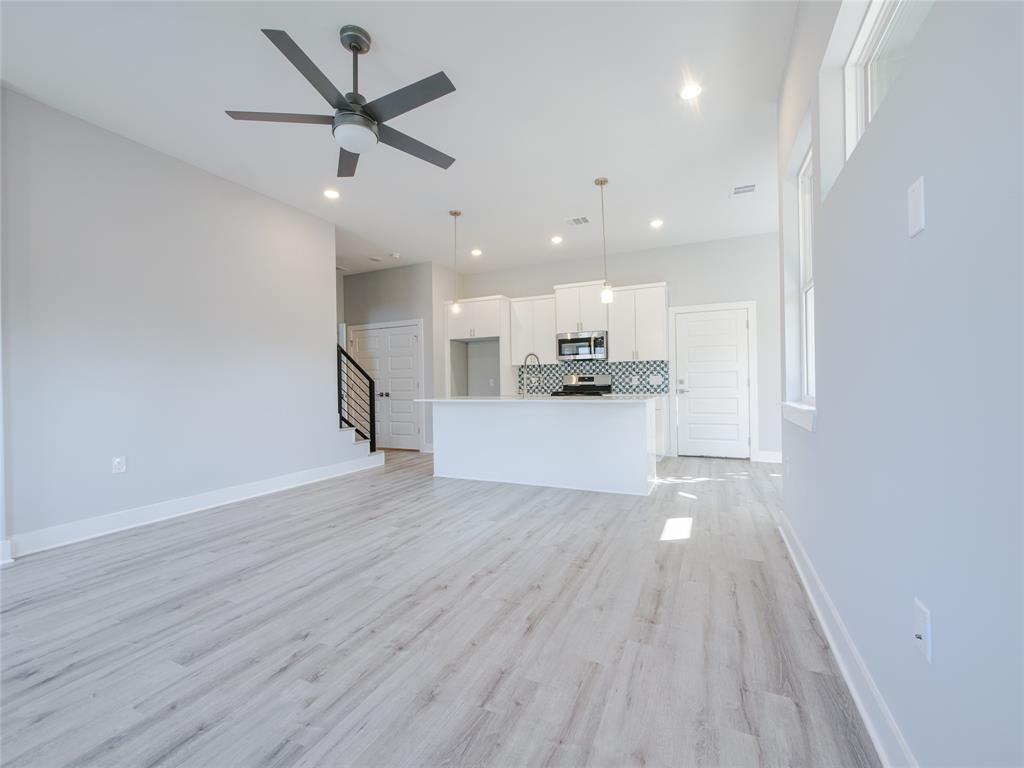 1042 Rosemont Street, Unit 1 Austin, TX 78723 - Photo 7 of 31 a view of a kitchen with a sink and wooden floor