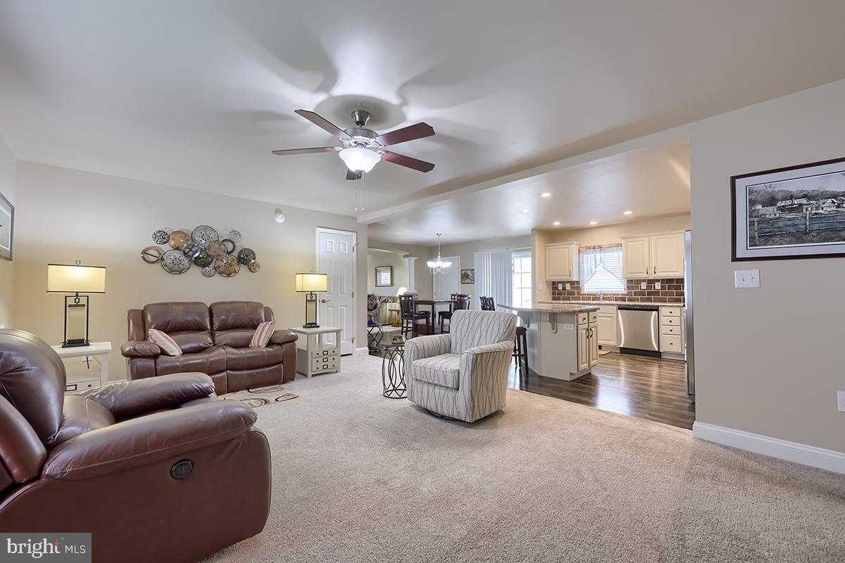 39 Westin Road Douglassville, PA 19518 - Photo 19 of 37 a living room with furniture and a chandelier