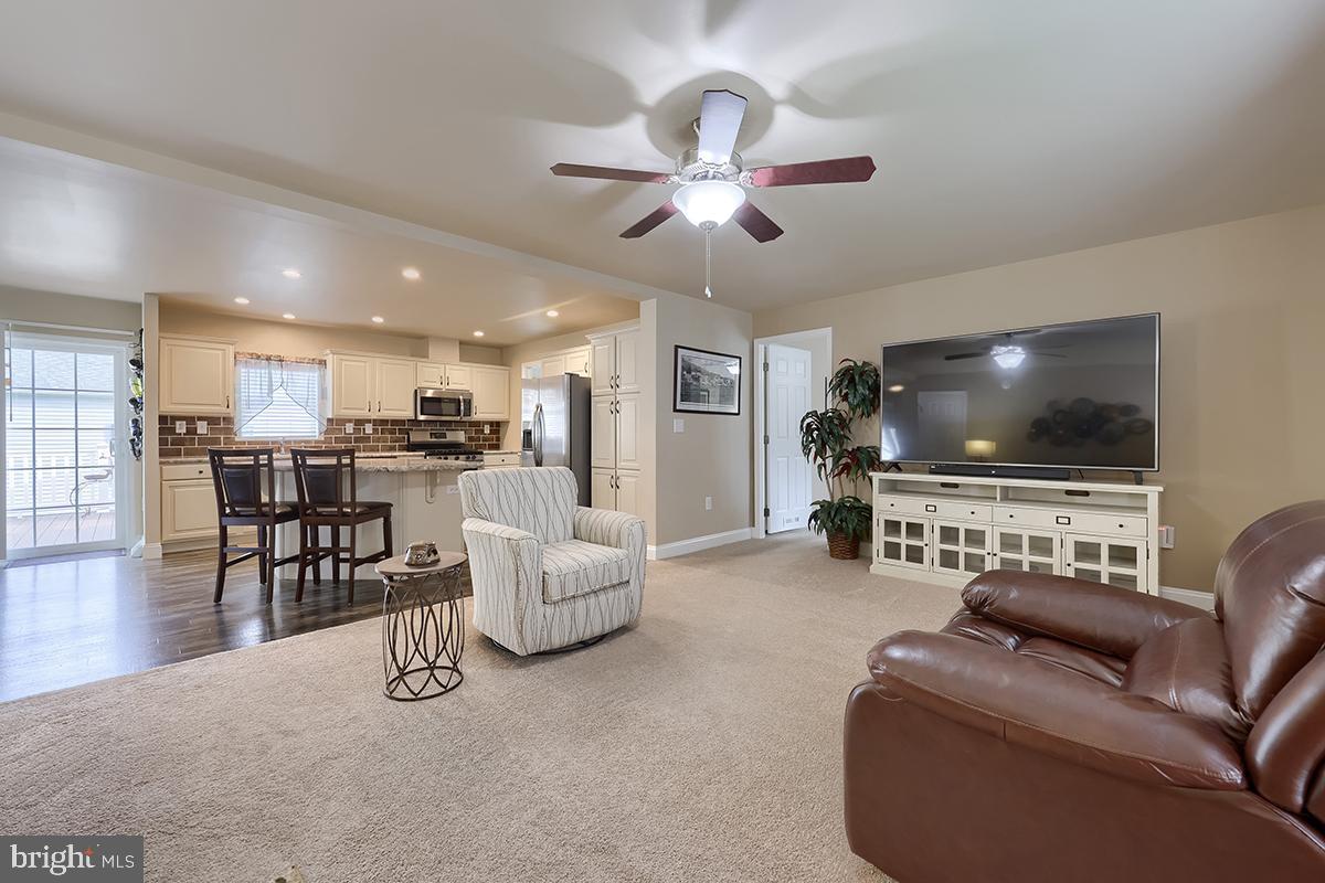 39 Westin Road Douglassville, PA 19518 - Photo 20 of 37 a living room with furniture and a flat screen tv