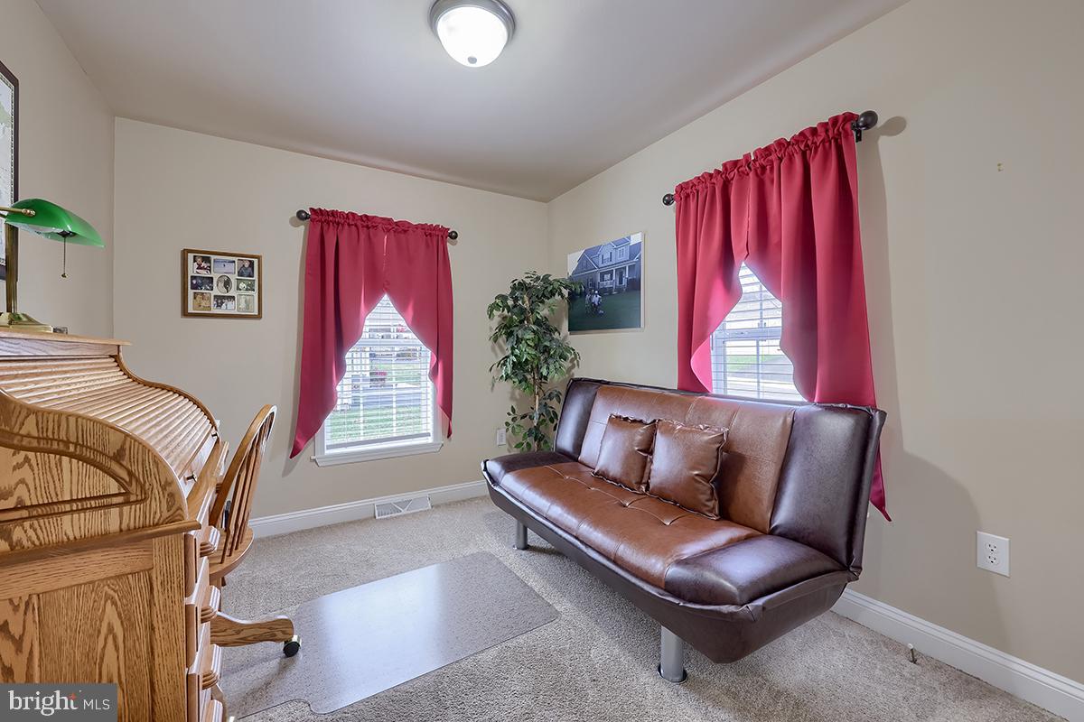 39 Westin Road Douglassville, PA 19518 - Photo 23 of 37 a living room with furniture and a window