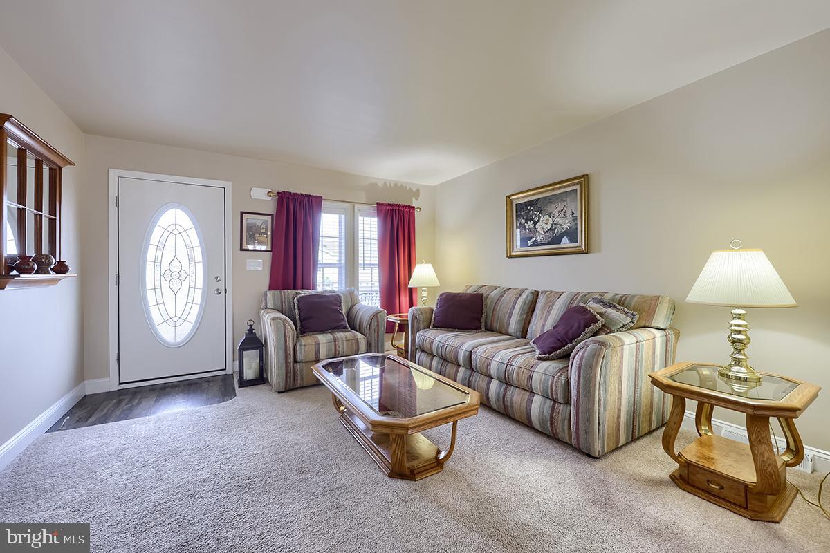 39 Westin Road Douglassville, PA 19518 - Photo 4 of 37 a living room with furniture a window and a lamp