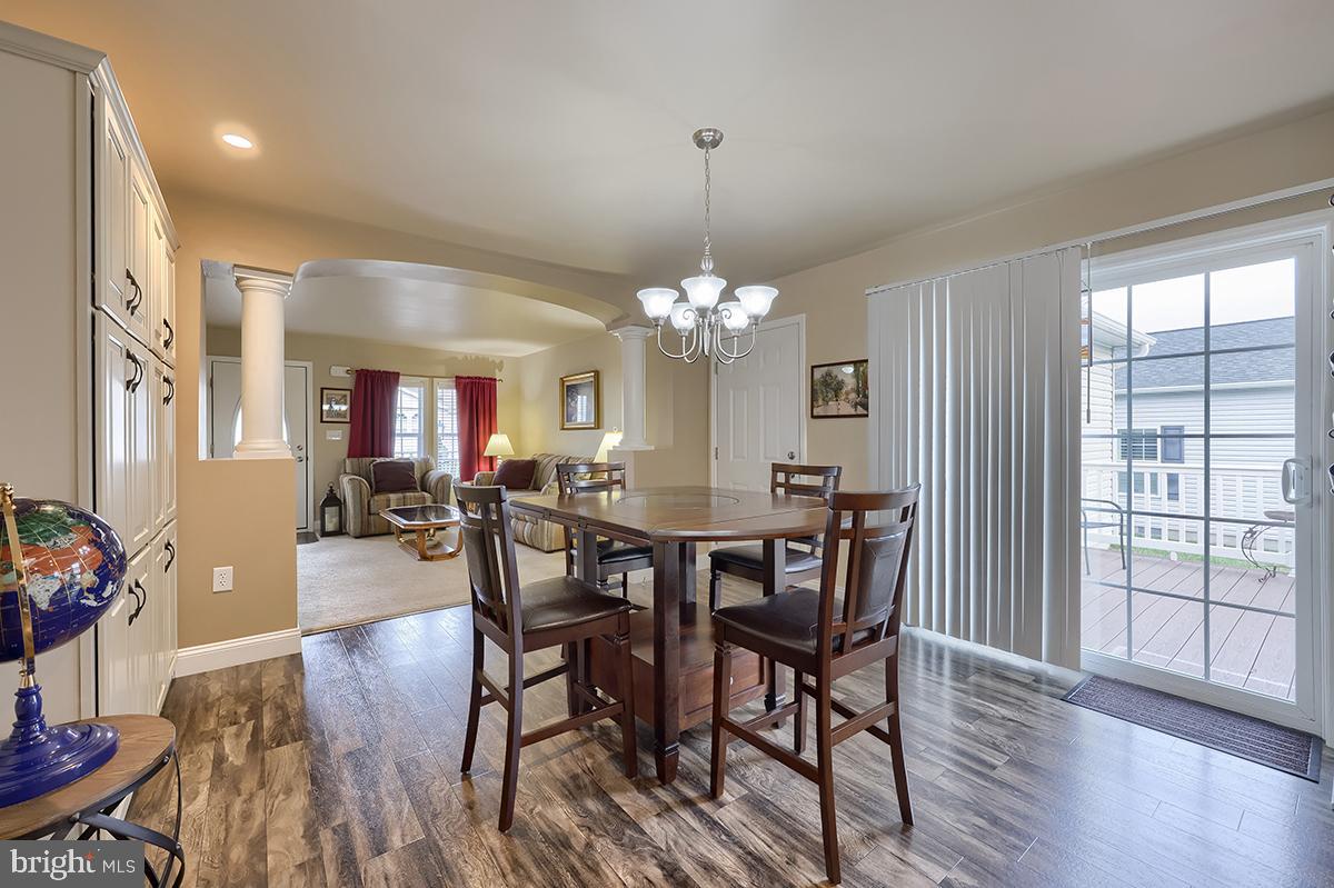 39 Westin Road Douglassville, PA 19518 - Photo 9 of 37 a view of a dining room with furniture window and wooden floor