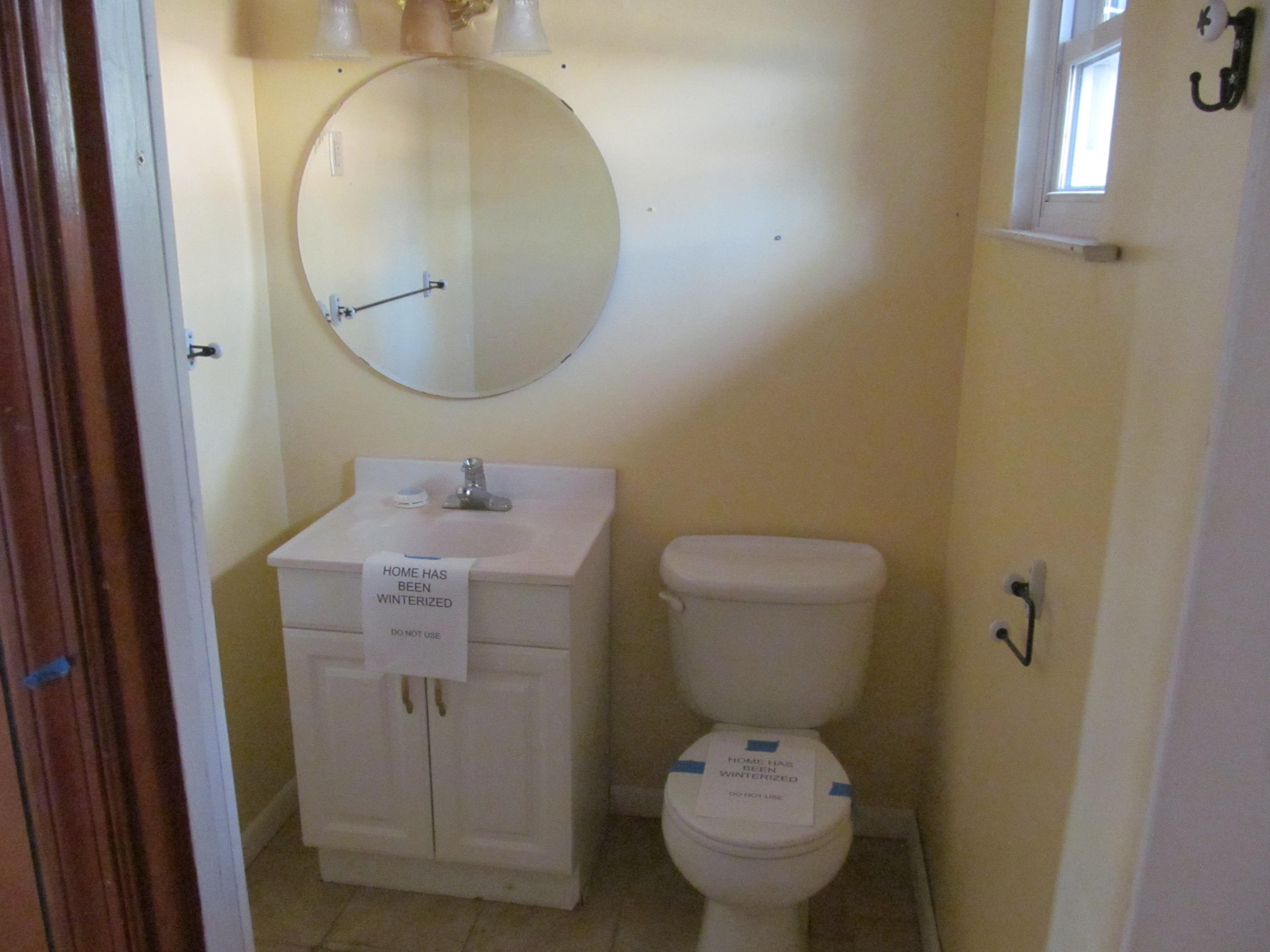 624 Ramada Road Vinton, VA 24179 - Photo 18 of 25 a bathroom with a sink toilet and a mirror